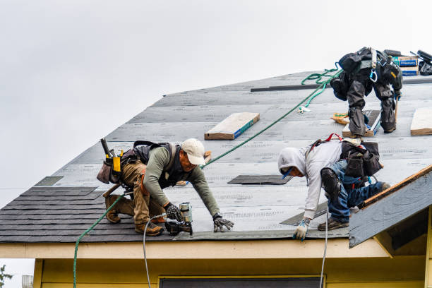 Professional Roofing technician working in Wainscott, NY